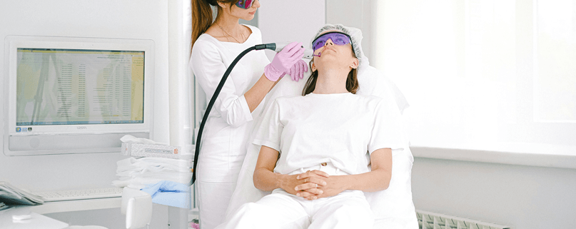 Patient receiving laser skin treatment at a facial rejuvenation clinic in Sydney